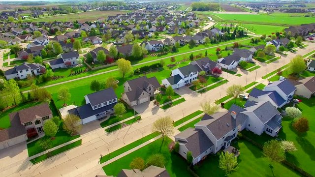 Beautiful, suburban neighborhood with stunning homes, aerial view.
