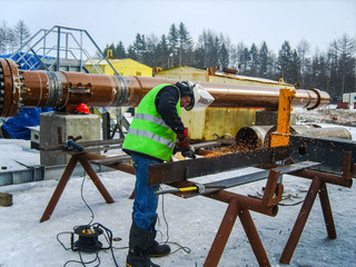 Safety at work. Welding and grinding of iron constructions. Industrial weekdays welders and fitters