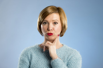 blond woman looking suspicious and grumpy in discontent and tension face expression