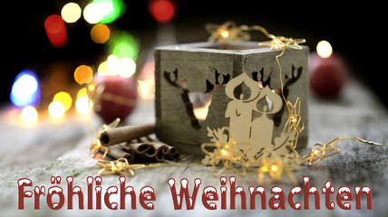 Schrift Weihnachten und Advent mit Kerze Schnee und Bokeh