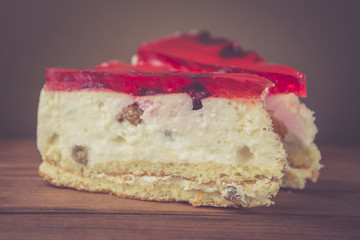 Fresh cherry cheesecake with red jelly and raisins