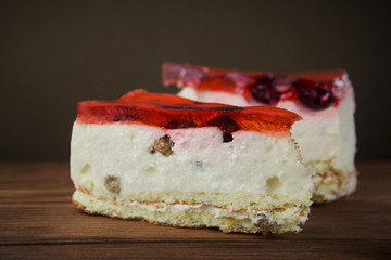 Fresh cherry cheesecake with red jelly and raisins