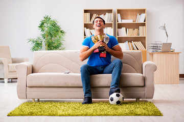 Man watching football at home