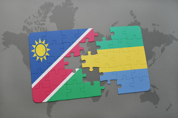 puzzle with the national flag of namibia and gabon on a world map