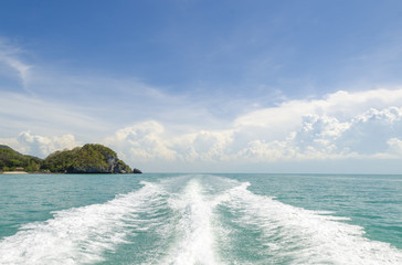 Naklejka premium Fishing speedy boat prop wash, white wake on the blue ocean sea