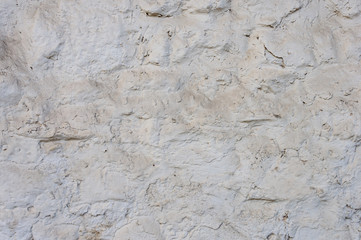 Rough white stone wall background