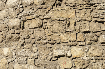 Brown rough stone wall background
