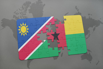 puzzle with the national flag of namibia and guinea bissau on a world map