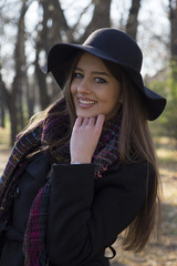 Young beautiful woman with a hat