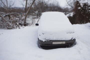 snow-covered car