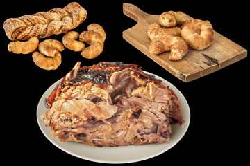 Plateful Of Spit Roasted Pork Ham With Croissant Puff Pastry Isolated On Black Background