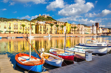 Colorful houses and boats in Bosa, Sardinia, Italy, Europe - 129368195