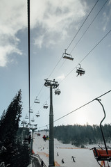 The lift for skiers in the winter mountains.