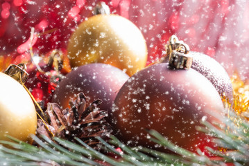 Christmas balls lying on spruce branches.