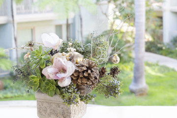 Bouquet has Christmas tree branches and artificial flowers. Christmas flower composition is for the interior house. 