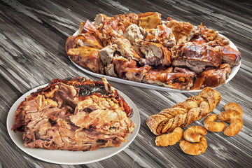 Plateful Of Spit Roasted Pork Slices And Juicy Ham With Sesame Puff Pastry Set On Old Wooden Garden Table