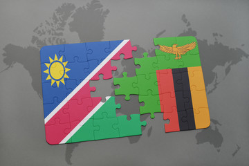 puzzle with the national flag of namibia and zambia on a world map