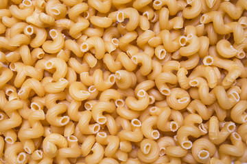Pasta, macaroni horns background, texture