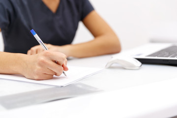 hand business woman writing pen on paper on desktop