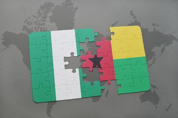 puzzle with the national flag of nigeria and guinea bissau on a world map