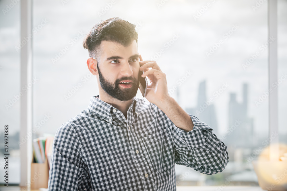 Wall mural Handsome man on the phone