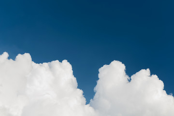 Naklejka na ściany i meble Closeup cumulus clouds on blue sky