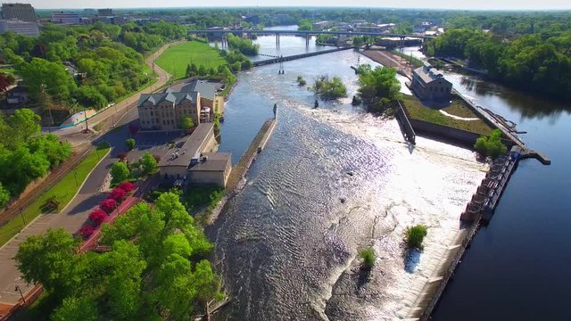 Aerial tour of scenic Fox River waterfront on a springtime morning, Appleton, Wisconsin.