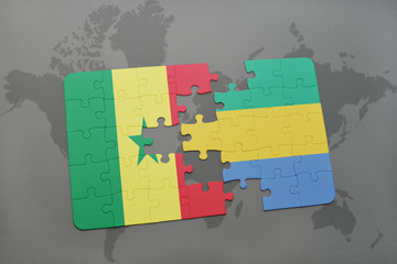 puzzle with the national flag of senegal and gabon on a world map