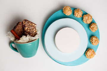 Chocolate in cup and boxes over white background. Above.