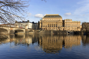 Fototapeta na wymiar Winter Prague National Theater above River Vltava, Czech Republic