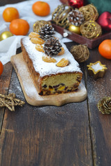 Fototapeta premium Christmas cake with dried fruits and tangerines