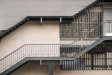 Exterior of office building with metal staircase 