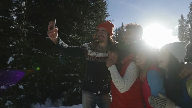 Man Hold Smart Phone Camera Taking Selfie Photo Friends Snow Forest Young People Group Outdoor Winter Pine Woods Slow Motion 120