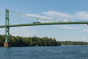 Bus on a tall bridge over St.Lawrence River in Ontario