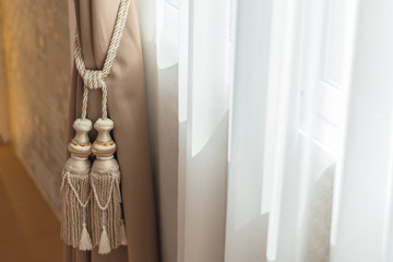 beautiful curtain tie by curtain strap with sunlight