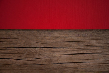 Christmas card, red taxtured paper on wooden background