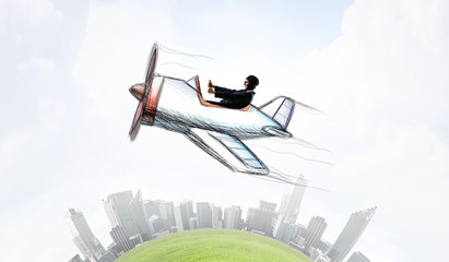 Woman pilot in drawn airplane . Mixed media