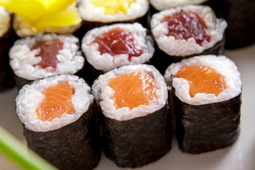various of maki sushi on white plate