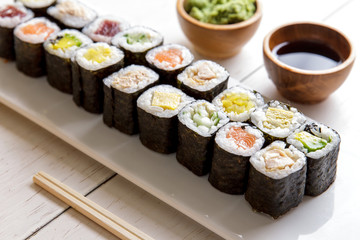 japanese food mini maki sushi platter on white wooden table © Odua Images
