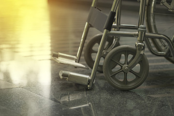 Empty wheelchair parked in hospital