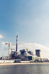 Obraz premium modern power plant near water