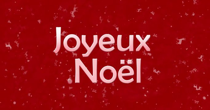 Merry Christmas text in French "Joyeux Noel" formed from dust and turns to dust horizontally on red animated background
