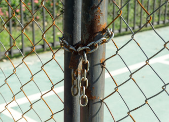 padlock and chain on metal door
