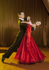 Beautiful couple in the active ballroom dance
