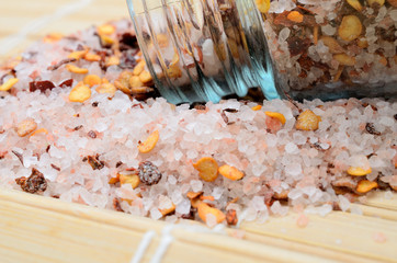pink salt with chili seed on table