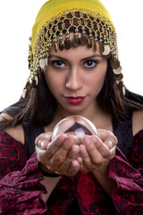 Close up of female fortune teller or psychic with clear crystal ball for composites.  Facial...