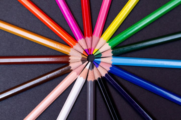 Color pencils isolated on black background