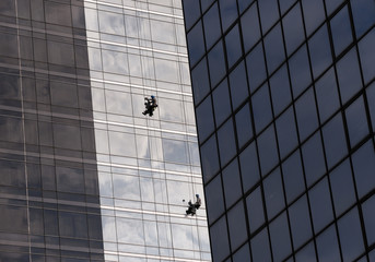 Window cleaners work on skyscraper