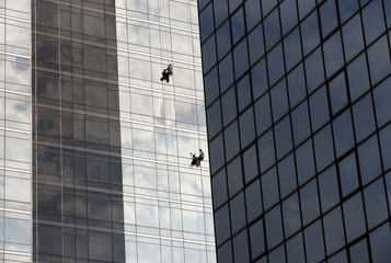 Window cleaners work on skyscraper