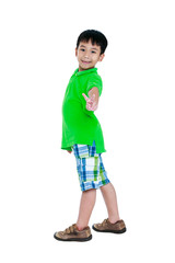 Full body of happy asian child smiling and looking at camera.